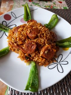 Una foto de Arroz ensopado con cerveza y salchicha