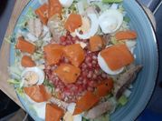 Una foto de ensalada escarola y granada