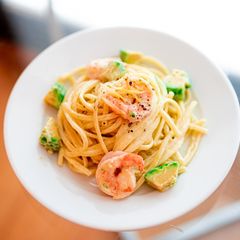 A picture of Shrimp and avocado pasta with lemon cream.