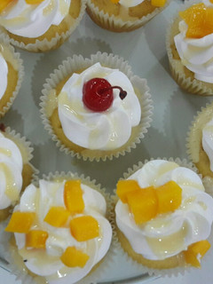 Una foto de Cupcake de maracuyá y mango