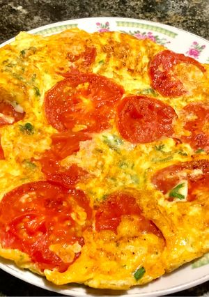 Una foto de Tortilla de tomate frito