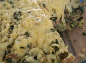 Una foto de Chayotes con queso fundido