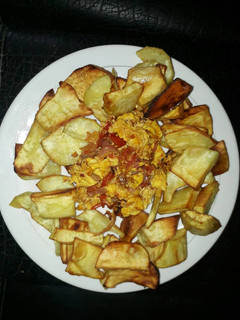 A picture of Fried sweet potatoes with fried eggs.
