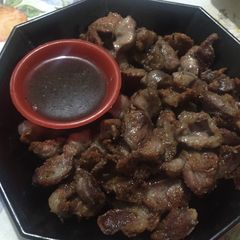 A picture of Fried gizzard with vinegar dip.