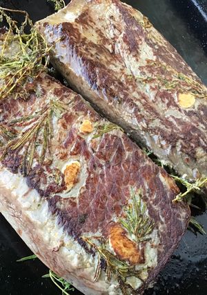 A picture of Beef Filets with Marinated Garlic, Thyme, and Rosemary.