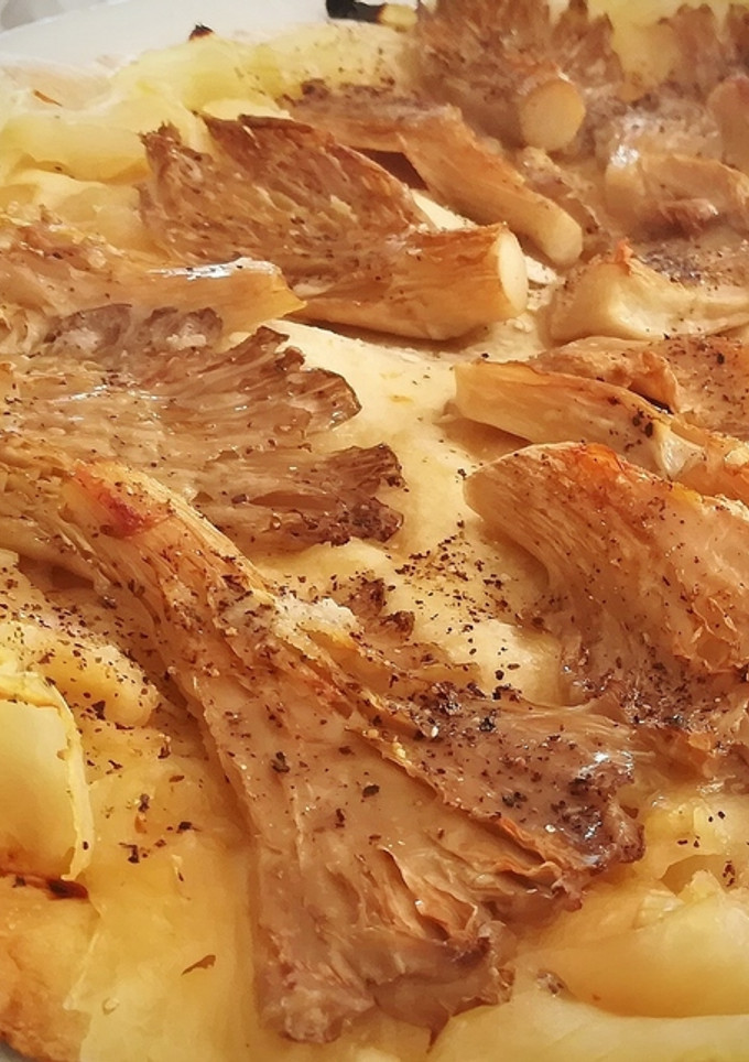 Una foto de Coca de setas de cardo