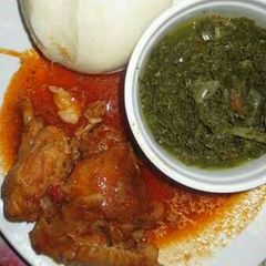 A picture of Stewed Chicken served with veges and Ugali.