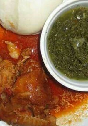 A picture of Stewed Chicken served with veges and Ugali.