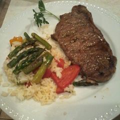 Garlic chili steak and warm rice salad A picture of Garlic chili steak and warm rice salad.