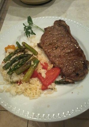 A picture of Garlic chili steak and warm rice salad.