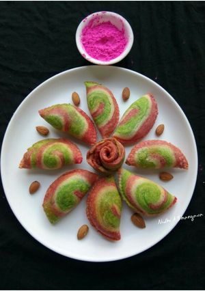 A picture of Colourful spiral Gujiyas.