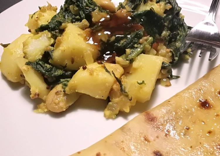 Vegan spinach, potato and bean dry curry