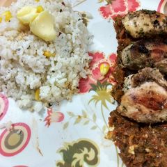 A picture of Lemon pepper grilled chicken with salsa sauce garlic butter rice.
