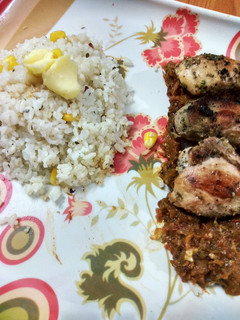 A picture of Lemon pepper grilled chicken with salsa sauce garlic butter rice.