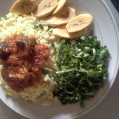 A picture of Curried Rice, vegetables and Kidney stew.