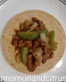 Pork Al pastor with sauteed onions and peppers