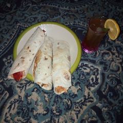 A picture of Meat Shawarma and lemon ice tea.