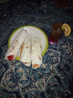 A picture of Meat Shawarma and lemon ice tea.