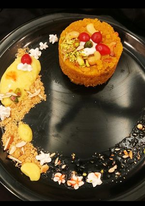 A picture of Moong halwa surprise with custard & cookies.