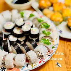 A picture of Two types of rolls with crab sticks.