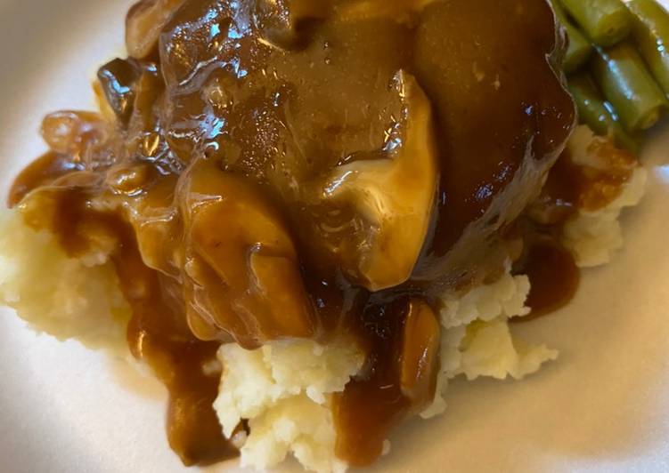 Simple Salisbury steaks over mashed potatoes