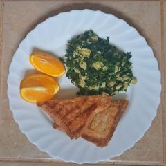 A picture of Eggs spinach & toast sandwich.