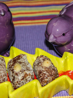 A picture of Date Rolls in Shredded Coconut.