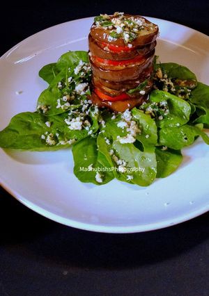 A picture of Grilled eggplant tomato salad.