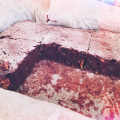 A picture of Brownies with bananas and nuts.