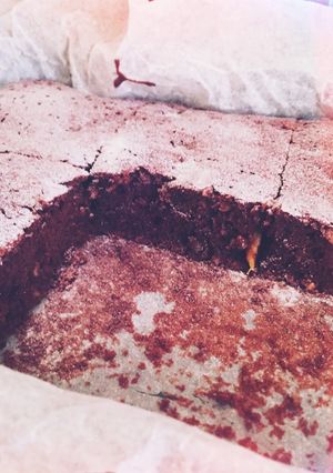 A picture of Brownies with bananas and nuts.