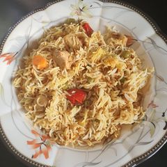 A picture of Boneless chicken and vegetable rice.