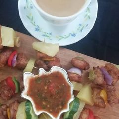 Mini Chicken Satay with salsa A picture of Mini Chicken Satay with salsa.