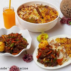 A picture of Biryani rice and beef curry sauce.