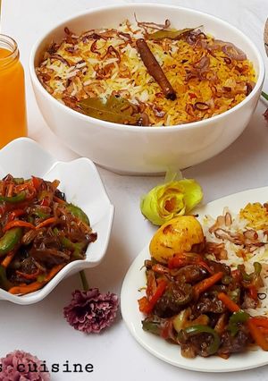 A picture of Biryani rice and beef curry sauce.