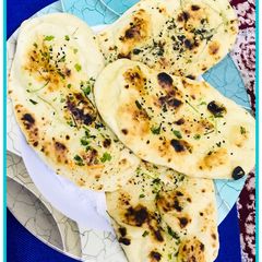 A picture of Kulche /garlic butter naan.