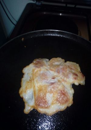 A picture of Smokie fried in egg.