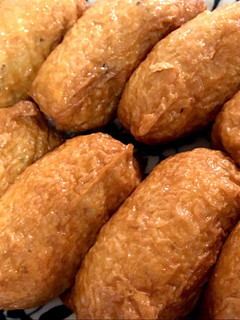 A picture of Inarizushi (sushi rice in seasoned Aburaage).