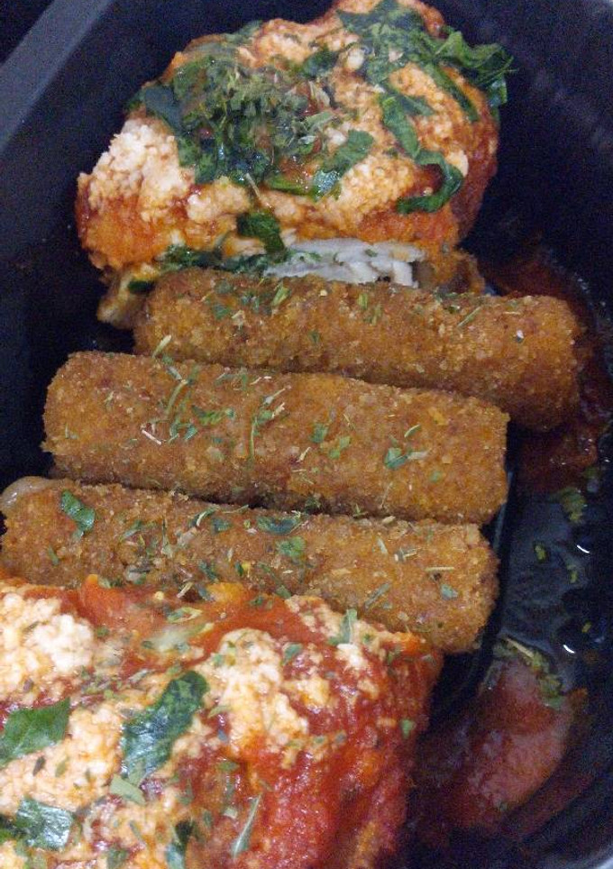 Una foto de Pechuga Parmesana Con Espinacas