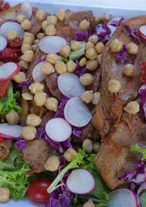 A picture of Roasted Pork Fillets on Mixed Leaves Salad.