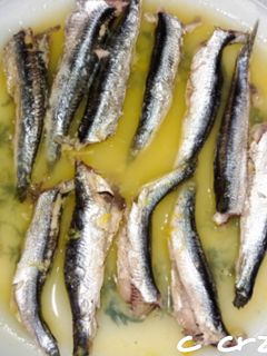 Una foto de Boquerones en zumo de naranja, al microondas