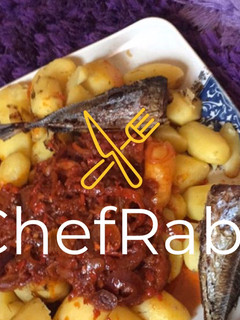 A picture of Boiled potatoes,fried fish and sauce.