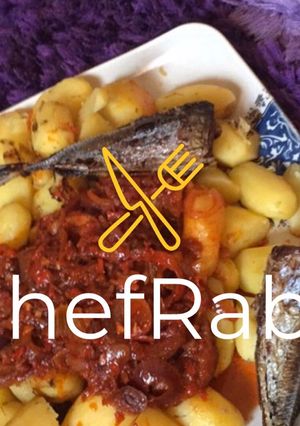 A picture of Boiled potatoes,fried fish and sauce.