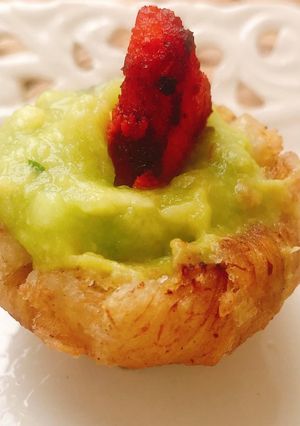 A picture of Plantain Baskets Topped with Guacamole & Chicken Tikka.