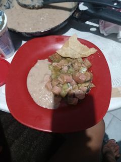 Una foto de Salchicha en salsa verde con papa y champiñones