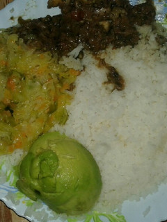 A picture of Boiled rice,wet fry beef and steamed cabbage and Avocado.
