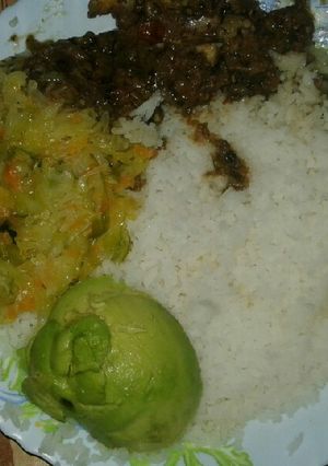 A picture of Boiled rice,wet fry beef and steamed cabbage and Avocado.