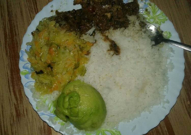 Boiled rice,wet fry beef and steamed cabbage and Avocado