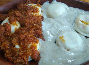 Una foto de Sorrentinos de calabaza y queso con salsa doble