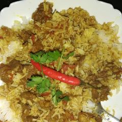 Rice and mbuzi stew A picture of Rice and mbuzi stew.