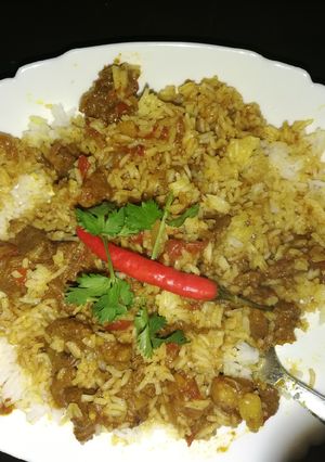 A picture of Rice and mbuzi stew.